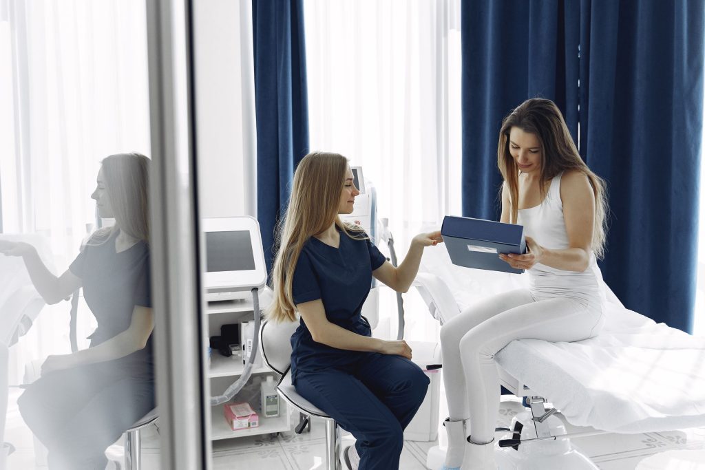 woman with doctor cosmetolog
